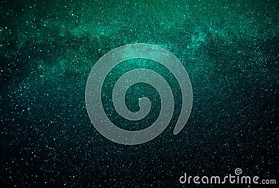 Abstract galaxy background with stars and planets with green and blue galaxy motifs of the night light of the universe Stock Photo