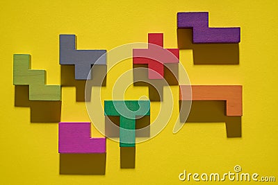 Abstract geometric background, colorful logic game. Isometric game blocks on yellow background. Pop art style design. Stock Photo