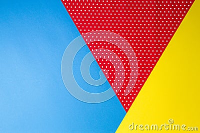 Abstract geometric blue, yellow and red polka dot paper background. Stock Photo