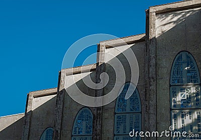 Abstract geometric lines of Facade Details of historic church. Pattern and sculpture, arches. Dark cathedral building Stock Photo