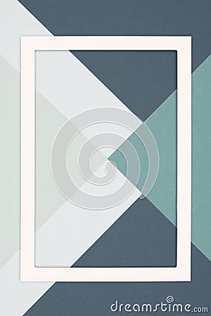 Abstract geometrical cold grey and green colored flat lay paper background. Minimalism template with empty picture frame. Stock Photo