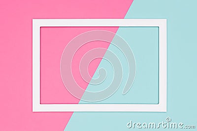 Abstract geometrical pastel blue and pink colored paper flat lay background. Minimalism template with empty picture frame. Stock Photo