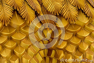 Abstract geometrical wavy background from golden metal with ethnic patterns. Stock Photo