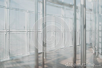 Abstract glass and chrome office interior background in sun rays Stock Photo
