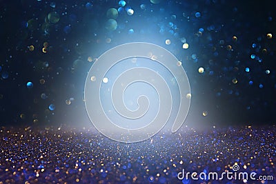 Abstract glitter lights background. blue, gold and black. de focused Stock Photo