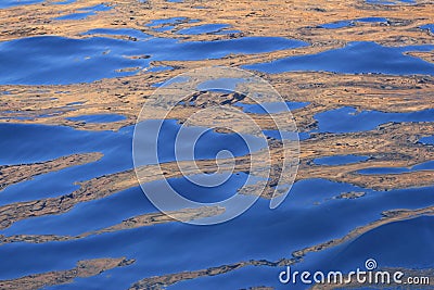 Abstract golden reflection blue water shapes Stock Photo