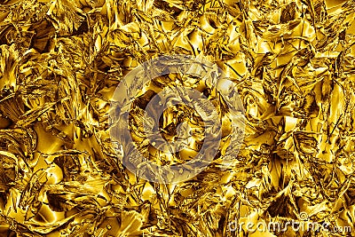 Abstract golden shiny metallic background, gold colored blurred flower petals backdrop, decorative yellow glowing texture Stock Photo