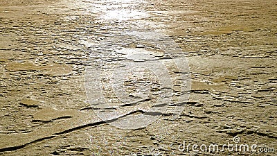 Abstract golden shot of sunlight on icy surface Stock Photo