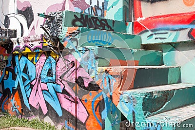 Abstract graffiti by an unidentified artist on wall. Editorial Stock Photo