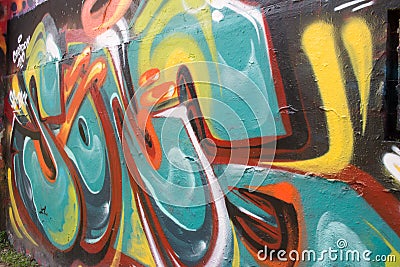 Abstract graffiti by an unidentified artist on wall. Editorial Stock Photo