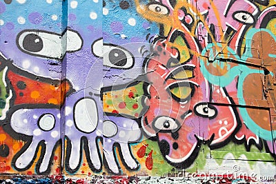 Abstract graffiti by an unidentified artist on wall. Editorial Stock Photo