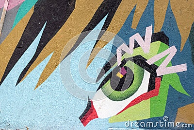 Abstract graffiti by an unidentified artist on wall. Editorial Stock Photo