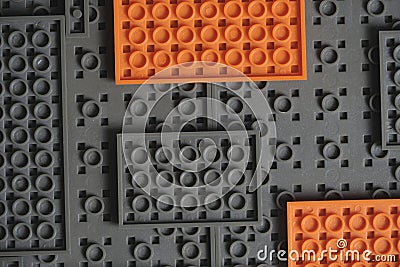 Abstract gray orange background from lego children designer Stock Photo