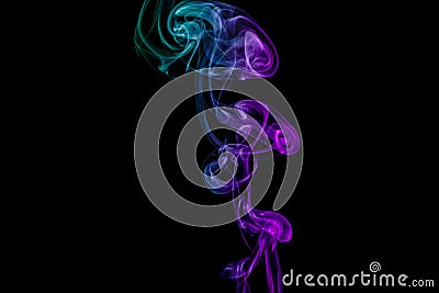 Abstract green and purple smoke from the aromatic sticks. Stock Photo