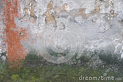Creative background. Green, grey and orange rough weathered stone texture with moss, stucco and paint Stock Photo