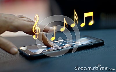 Abstract hand playing music notes on smartphone Stock Photo