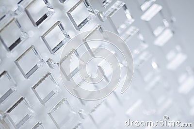 Abstract high-tech background. A sheet of transparent plastic or glass with the cut out holes. Laser cutting of Stock Photo