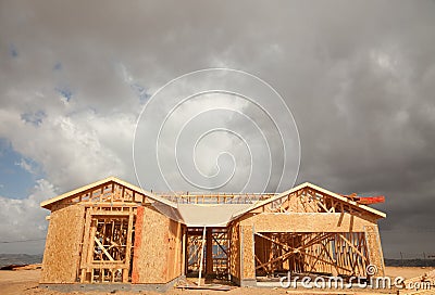 Abstract Home Construction Site and Ominous Clouds Stock Photo