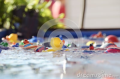 Abstract Hook a Duck game at fair ~ Perspective small child Stock Photo
