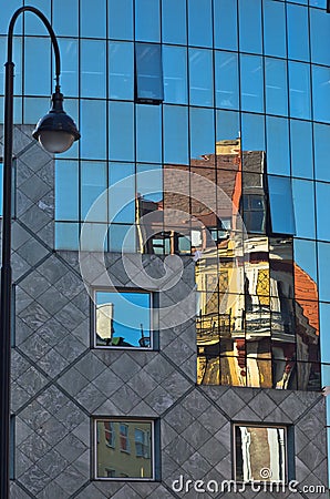 Abstract image as a reflection of old style buildings in a glass of Haas house at downtown of Vienna Stock Photo