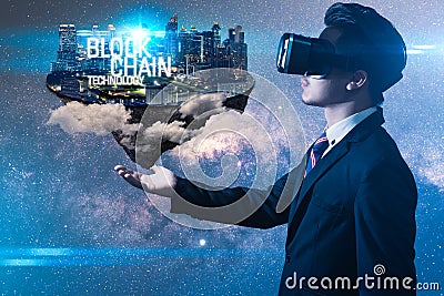 The abstract image of the business man hold the blockchain hologram on hand. the concept of cryptocurrency, blockchain, internet o Stock Photo