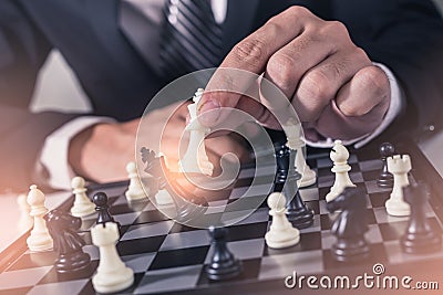 The abstract image of the businessman take a checkmate on the chess board during the games Stock Photo