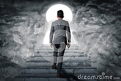 The abstract image of the businessman Walk up the stairs on the rooftop. The concept of modern life, business, city life and futur Stock Photo