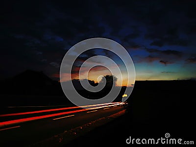 Abstract image with colorful stripes in front of a dramatic sky Stock Photo