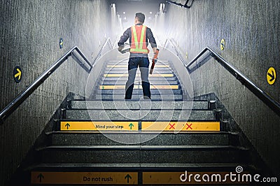 The abstract image of the engineer walk up the stairs. The concept of constructions, city, engineering and future. Stock Photo