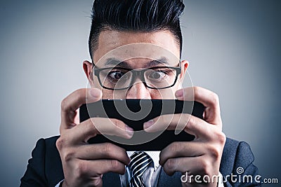 The abstract image of the gamer playing video game by the smartphone. Stock Photo