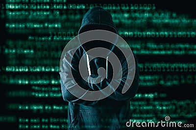 The abstract image of the hacker standing and the binary code image is backdrop. the concept of cyber attack, virus, malware, ille Stock Photo