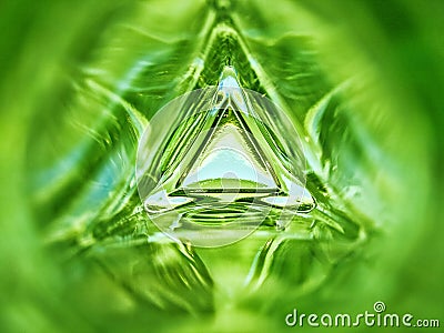 Abstract image of the inside of a triangle glass bottle emerald green color background Stock Photo