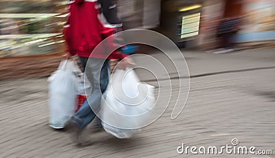 Abstract image of a man in sportswear with shopping plastic bags Stock Photo