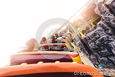 The abstract image of the roller coaster running on the rail in amusement park. Editorial Stock Photo