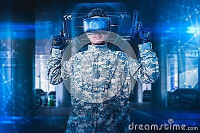 The abstract image of the soldier use a VR glasses for combat simulation training overlay with the hologram. the concept of virtua Stock Photo