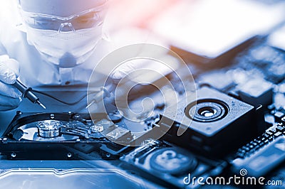 The abstract image of the technician assembling inside of smartphone by screwdriver in the lab. the concept of computer hardware, Stock Photo