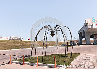 Abstract large spider figure stands at a gas station on the road leading from Kutaisi to Gori in Georgia Editorial Stock Photo