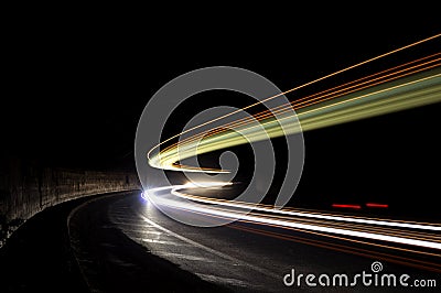 Abstract lights in a car tunnel in white, green, orange Stock Photo