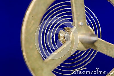 Abstract: Looking Through a Vintage Metallic Balance Wheel to Its Hairspring Stock Photo