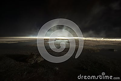 Abstract mars like terrain, muddy puddles of water textures, rocks, heavy fog Stock Photo