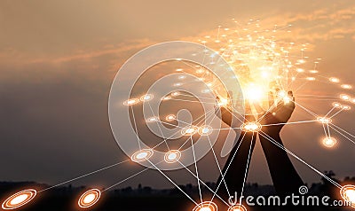 Abstract networking. Technology and communication. Hands holding global network and data exchanges on sunset background Stock Photo