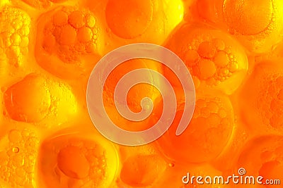 Abstract orange background from bubbles of red caviar on a gleam Stock Photo