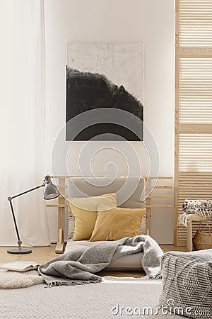 Abstract painting on the white wall of japanese inspired bedroom design Stock Photo