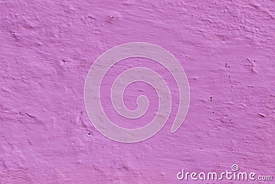 The surface of the walls is made of old uneven purple plaster. Stock Photo