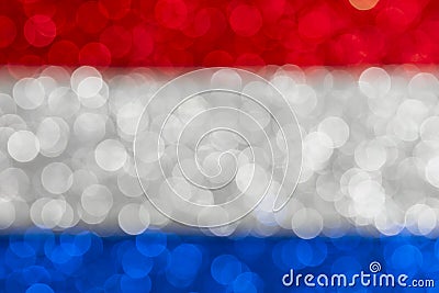 Abstract patriotic flag with bokeh lights, red white and blue glitter sparkle defocused background Stock Photo