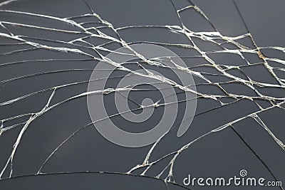 Abstract pattern dark gray background. Crackled screen of mobile cellphone. Gadget repair and maintenance concept Stock Photo