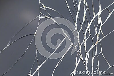 Abstract pattern dark gray background. Crackled screen of mobile cellphone. Gadget repair and maintenance concept Stock Photo