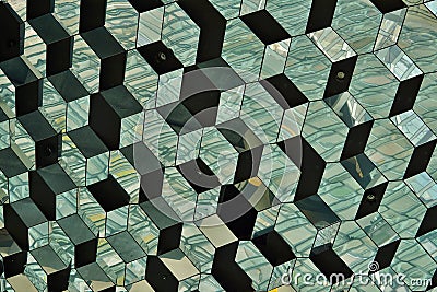 Abstract pattern made of glass wall with detail in the shapes of dark and bright hexagonal cells Stock Photo