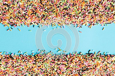 Abstract picture of colorful topping sugar.topping sugar sprinkles on blue background Stock Photo