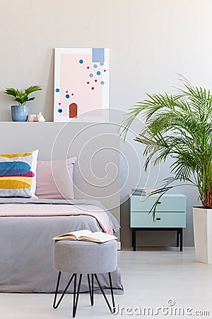 Abstract poster in real photo of bright bedroom interior with op Stock Photo